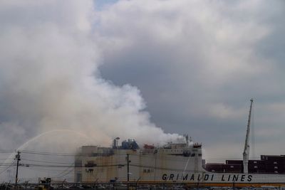 Fatal fire still burns on cargo ship in New Jersey, raising questions about response capability