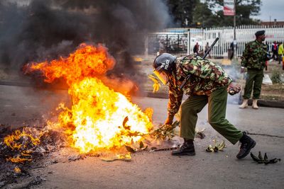 Activists in Kenya burn tires and block roads to protest taxes. Police detain more than 20 people