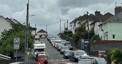 Work to a pavement has been causing traffic chaos in a Welsh village for nearly two years