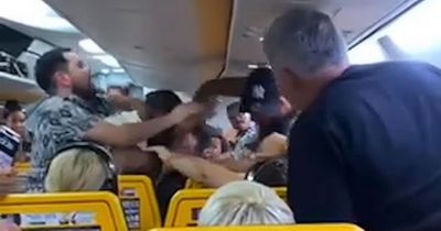 Chaotic moment Ryanair passengers brawl on flight in 'row over window seat'