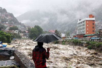 New Delhi schools close after monsoon floods kill at least 15, Pakistan on alert for more flooding