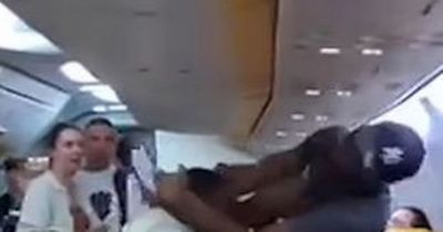 Shocking moment Ryanair passengers come to blows over window seat on flight