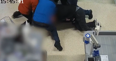 Moment gunman is arrested in Tesco after killing woman in Christmas Eve shooting