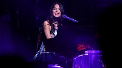 Olivia Rodrigo sits at the piano to deliver a stripped-back version of Vampire, and says that her dad is introducing her to Depeche Mode and The Cure