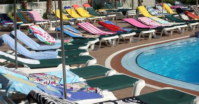 Security guard brutally removes 'reserved' towels from sun loungers at Tenerife hotel