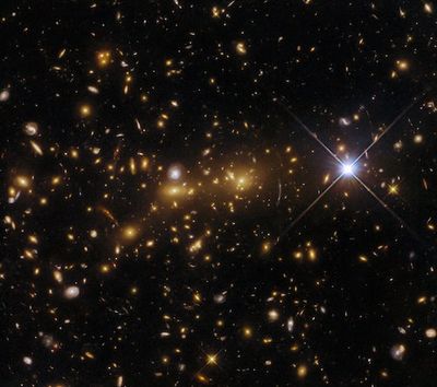 Hubble Telescope Spots Bizarre "Magnifying Glass" Optical Illusion Predicted by Einstein