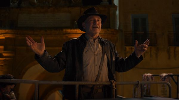 Harrison Ford staples Indiana Jones hat to his head in…