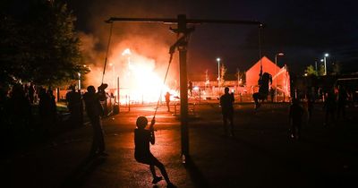 Belfast library windows boarded up due to bonfire at cost of £10,000