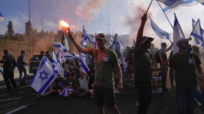 Israelis block highways to protest reform that would limit judicial checks on govt