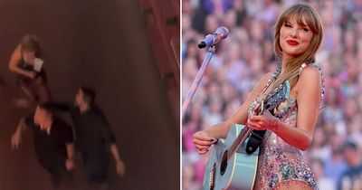 Fury as Taylor Swift fans throw objects at her forcing star to cower at concert