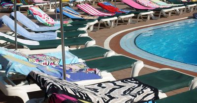 Hotel worker filmed removing 'reserved' towels from sun beds at Tenerife holiday hotel