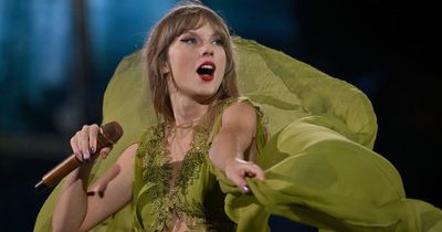 Taylor Swift forced to take cover as fans throw objects at her while exiting stage