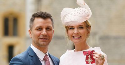 Rachel Riley supported by husband Pasha Kovalev as she accepts the MBE from King Charles