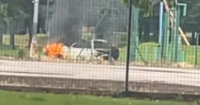 'Fireworks launched at police station' and car set alight after day of chaos and disorder in Salford