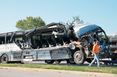 3 dead and 14 injured in Illinois crash involving Greyhound bus and tractor-trailers, police say