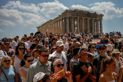 Tourists are packing European hotspots. And Americans don't mind the higher prices and crowds