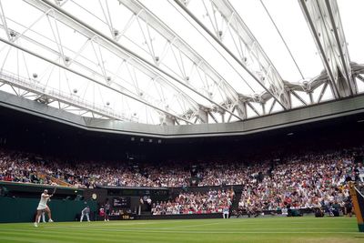 Wimbledon set for more rain before blustery weekend