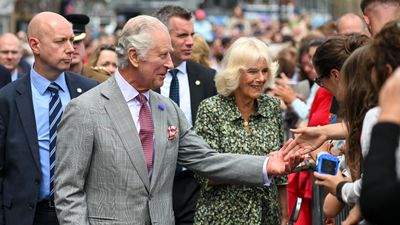 Queen Camilla's gold pyramid drop earrings mark departure from her usual style but they look great with a feathered bob