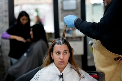 Bargain-hunting Uruguayans are flocking to Argentina as its peso slides. Back home, shops struggle