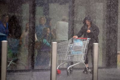 UK battered by wind and rain as Met Office issues weekend weather warnings