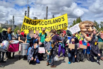Climate activists scale building at Ineos oil refinery