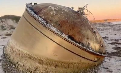 Mystery object: Australian police warn public away from huge cylinder found washed up on WA beach