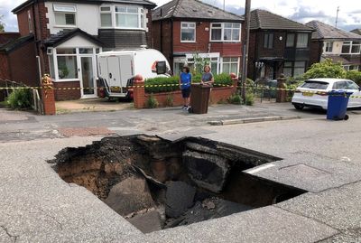 Huge sinkhole becomes tourist attraction in Manchester after sewer collapse