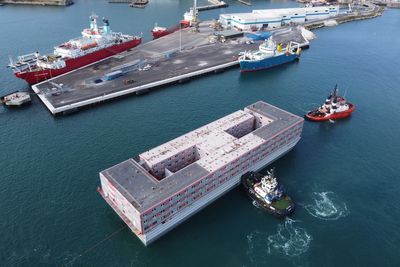 Bibby Stockholm met by protesters as it arrives into Portland Port