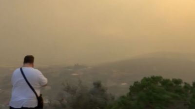 Watch as smoke rises from intensifying wildfires north of Athens