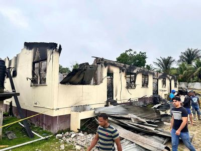 Guyana government reaches settlement with parents in dormitory fire that killed 20 children