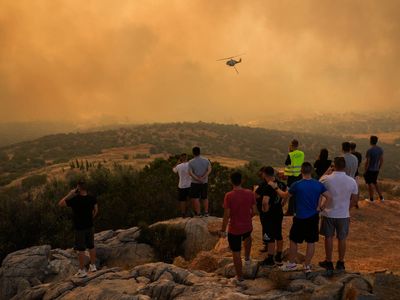 Families unable to cancel summer holidays despite extreme heat warnings and wildfires