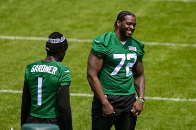 A shirtless Micheal Clemons entered Jets training camp with a Walking Dead-like spiked bat