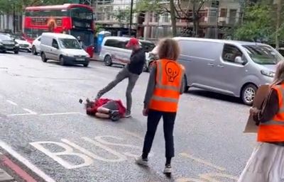 Just Stop Oil protestor punched and kicked by man following car accident