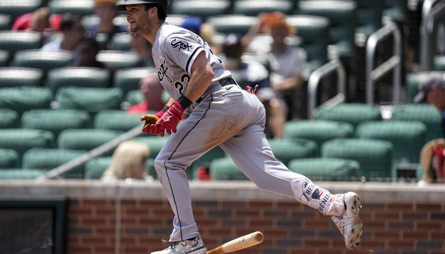 Chicago White Sox's Andrew Benintendi runs to first base during a