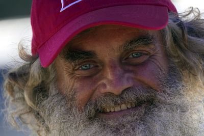 Australian sailor in emotional goodbye after floating three months lost at sea with a stray dog