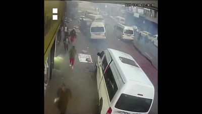 Johannesburg: Video captures moment suspected gas explosion threw buses into air, almost crushing man