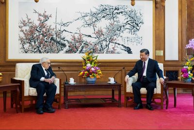 China's Xi tells Kissinger that China-US ties are at a crossroads and stability is still possible