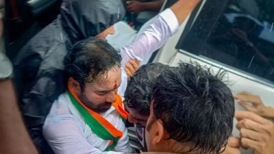 Union minister Kishan Reddy prevented by police from visiting Telangana housing project site; sits on road in protest
