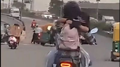 Couple hugs while riding motorcycle, Delhi Traffic Police slams Rs 11,000 fine on rider