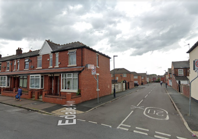 Woman, 50, dies in Manchester house fire after being pulled from window