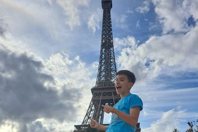 Teen who recovered from broken back completes charity Eiffel Tower climb