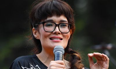 Man charged for alleged harassment of Yumi Stynes, who has received threats over sex education book
