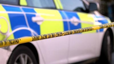 Two injured and man arrested after ‘car crashes through living room’