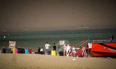 A wildfire is raging out of control on the Greek island of Rhodes, forcing tourist evacuations