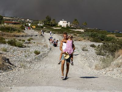 19,000 people have been evacuated as a wildfire rages on the Greek island of Rhodes