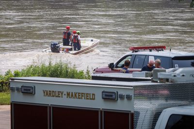 Police narrow search for infant lost in flash flood, after 2-year-old sister's body found