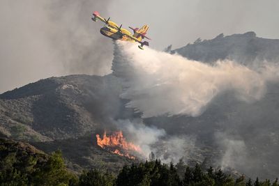 Greece fires – live: Red alert for Crete as British tourists in ‘living nightmare’ on Rhodes and Corfu