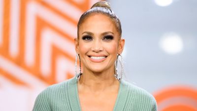 We’re in love with JLo’s super summery all-white outfit with flared trousers and huge platform heels