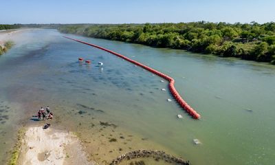 DoJ sues Texas governor over refusal to remove anti-migrant buoys from river