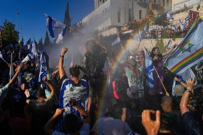 Israel’s parliament votes through Netanyahu’s controversial Supreme Court changes – despite mass protests